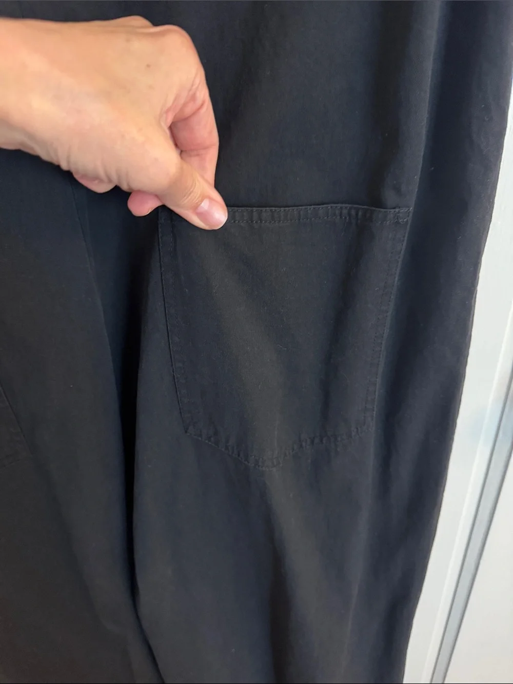 Sleeveless Black Jumpsuit with Front Buttons and utility pockets - Picture 4 of 12